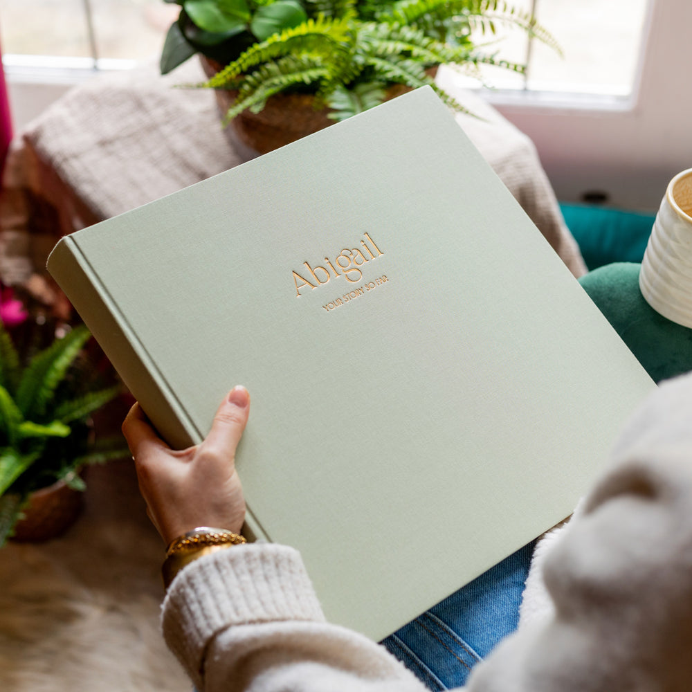 Beautiful personalised photo album with gold embossed title 