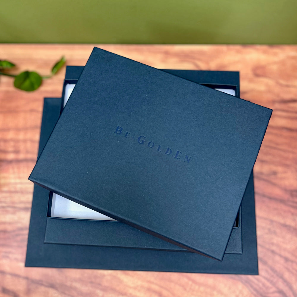 
                      
                        navy blue presentation boxes in a pile. The presentation boxes are bespoke and for protecting your begolen wedding guest book
                      
                    